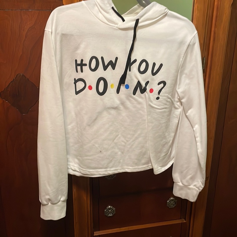A white cropped hoodie with a friends logo “how you doin”